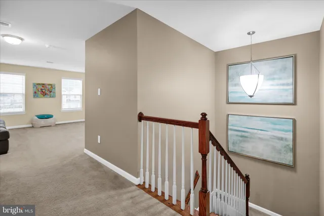 a view of walk in closet with clothes