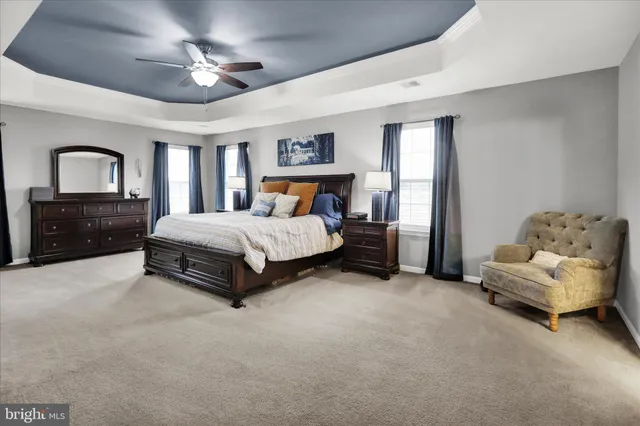 a view of a deck with table and chairs with wooden floor and fence