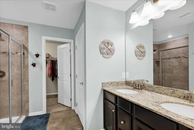 a view of a white house with a big yard and large tree