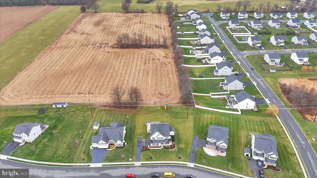 a aerial view of a house with swimming pool garden and mountain view