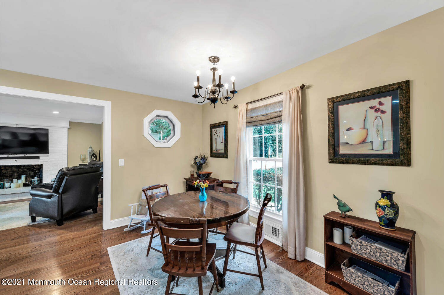 1207 Wall Road Spring Lake Heights, NJ 07762 - Photo 11 of 37 a living room with furniture a chandelier and a window