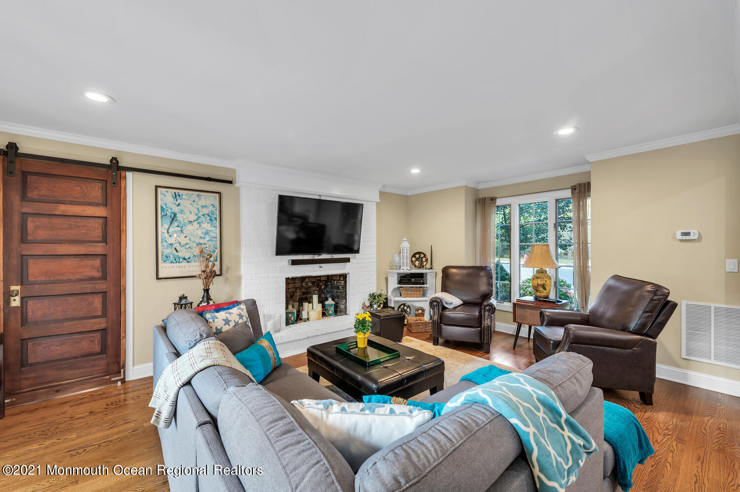 1207 Wall Road Spring Lake Heights, NJ 07762 - Photo 14 of 37 a living room with furniture a flat screen tv and a window