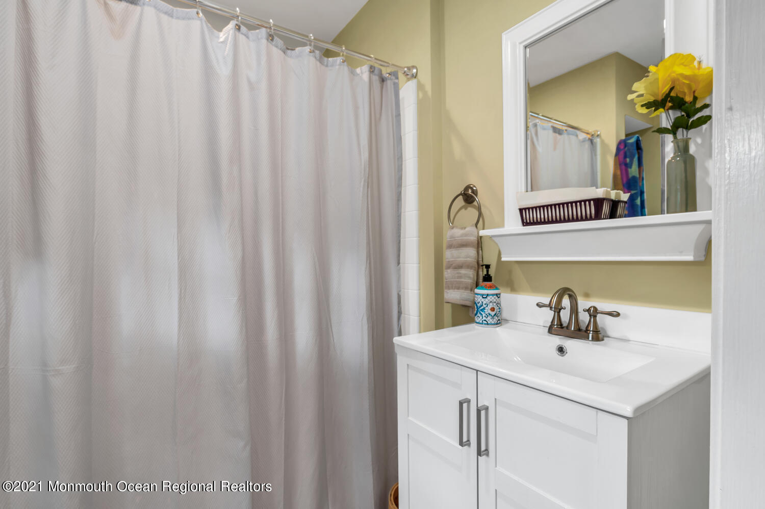 1207 Wall Road Spring Lake Heights, NJ 07762 - Photo 16 of 37 a bathroom with a sink vanity and a mirror