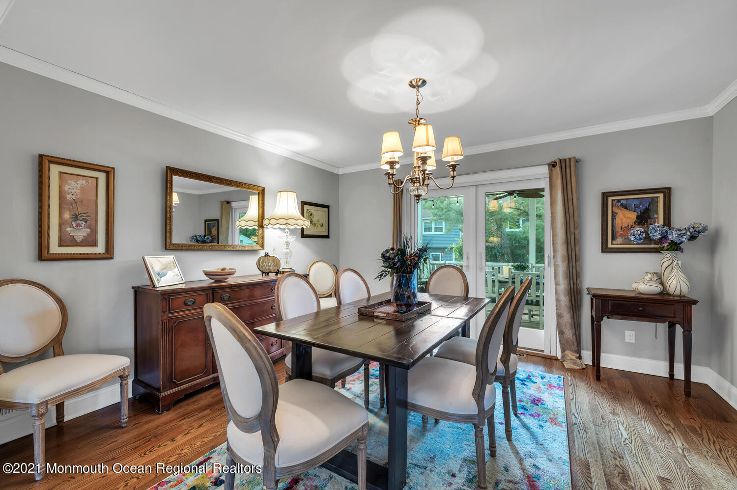 1207 Wall Road Spring Lake Heights, NJ 07762 - Photo 6 of 37 a dining room with furniture a chandelier and wooden floor