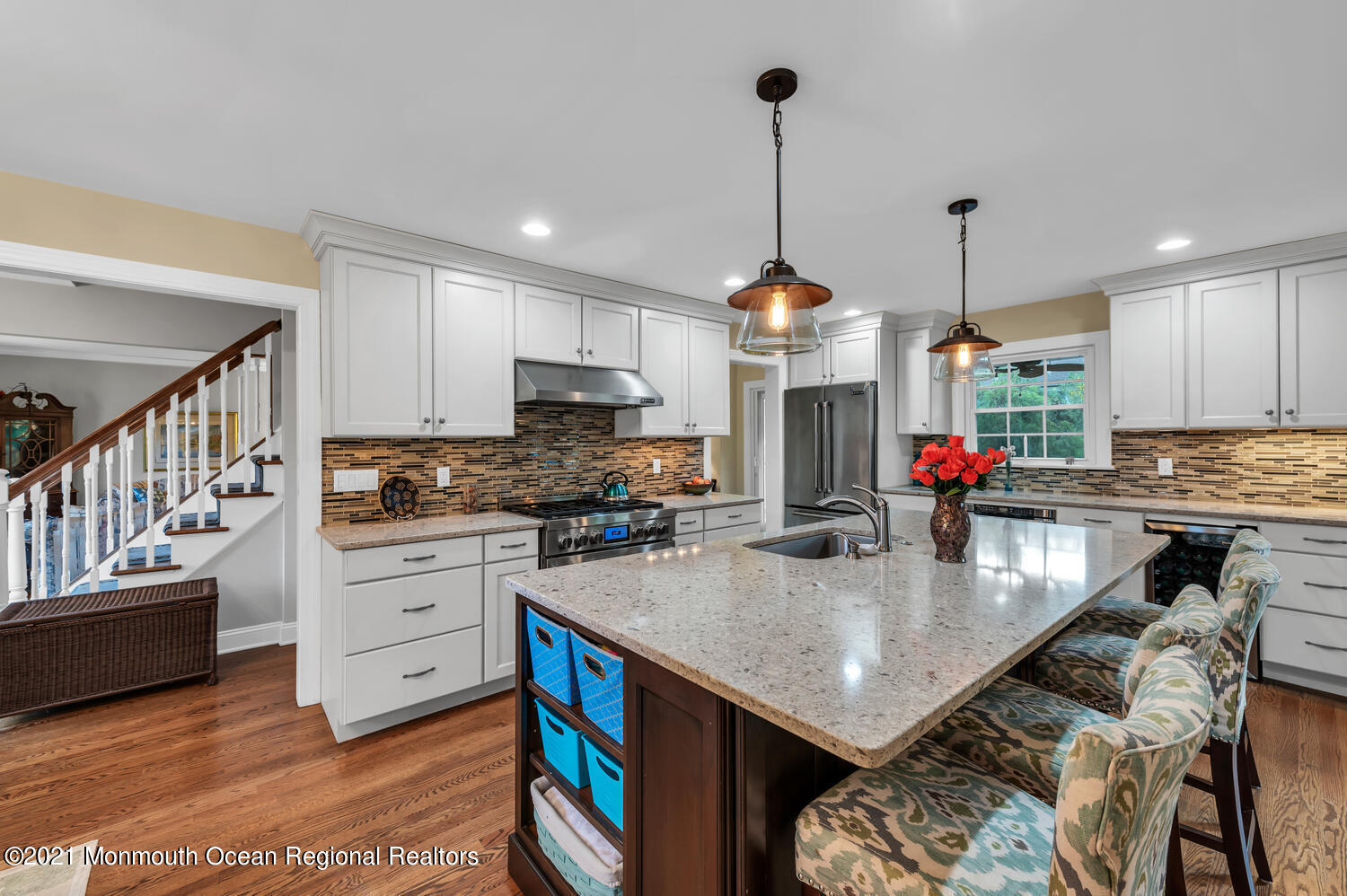 1207 Wall Road Spring Lake Heights, NJ 07762 - Photo 7 of 37 a kitchen with stainless steel appliances granite countertop a stove top oven a sink dishwasher and cabinets with wooden floor