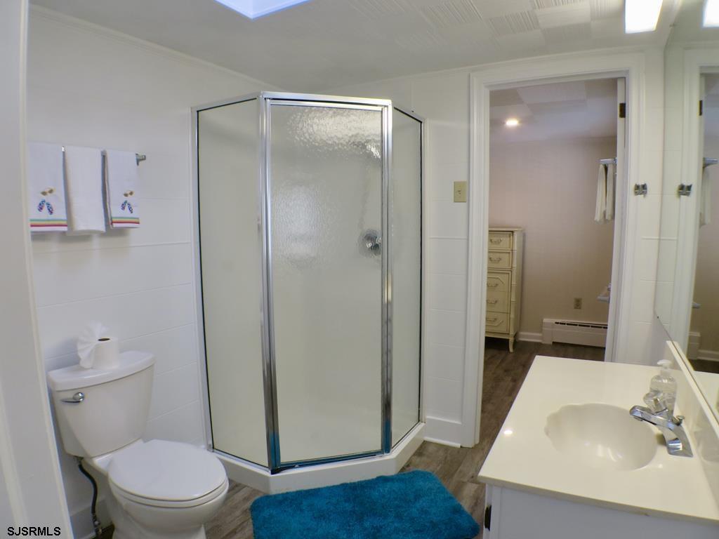 814 Wesley Road Ocean City, NJ 08226 - Photo 22 of 29 a bathroom with a sink a toilet and shower
