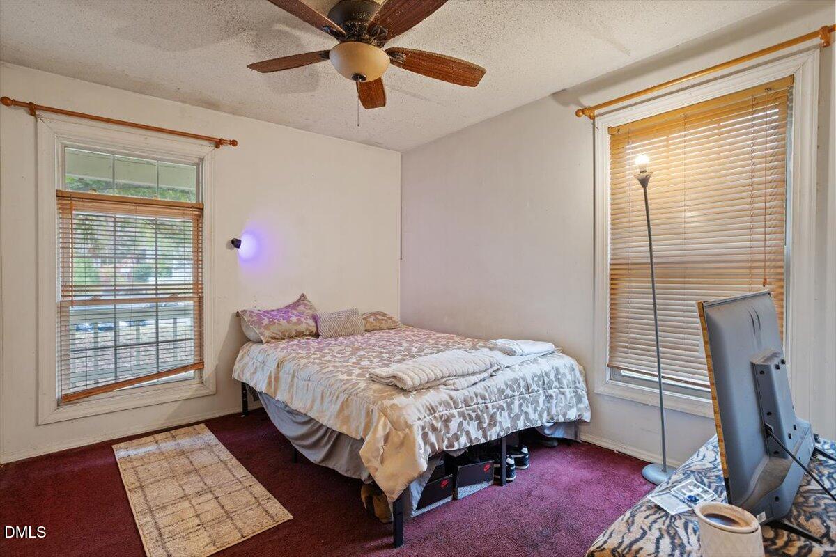 1600 Cranston Road Garner, NC 27529 - Photo 14 of 25 a bedroom with a bed and a window