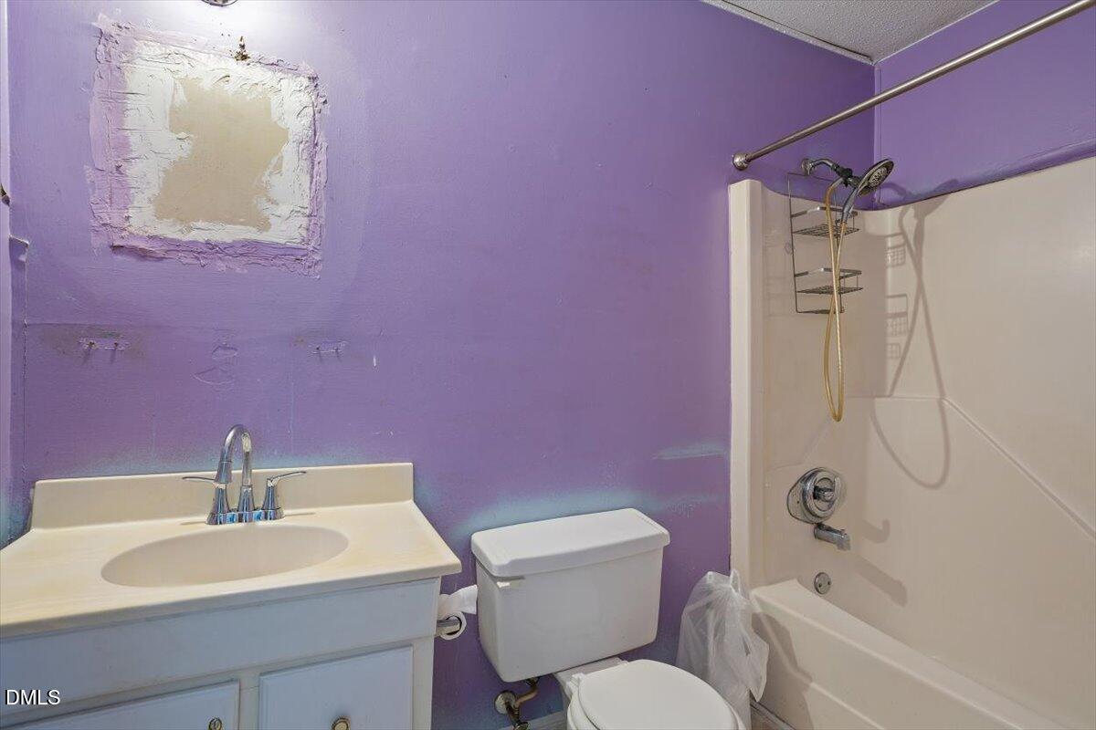 1600 Cranston Road Garner, NC 27529 - Photo 16 of 25 a bathroom with a sink toilet vanity and shower