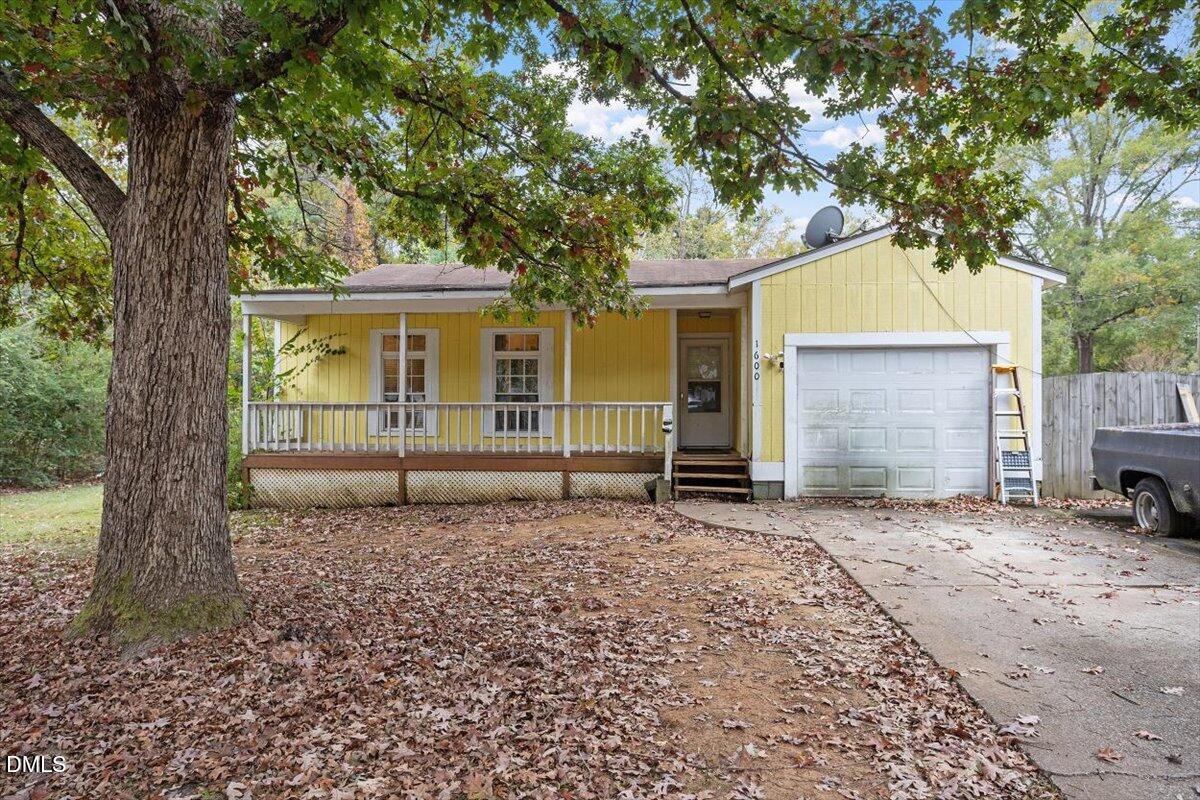 1600 Cranston Road Garner, NC 27529 - Photo 19 of 25 a house with trees in the background