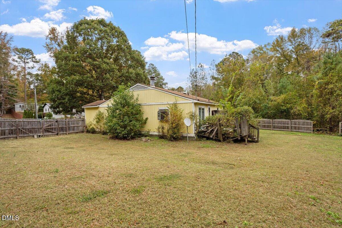 1600 Cranston Road Garner, NC 27529 - Photo 2 of 25 a view of a house with a backyard