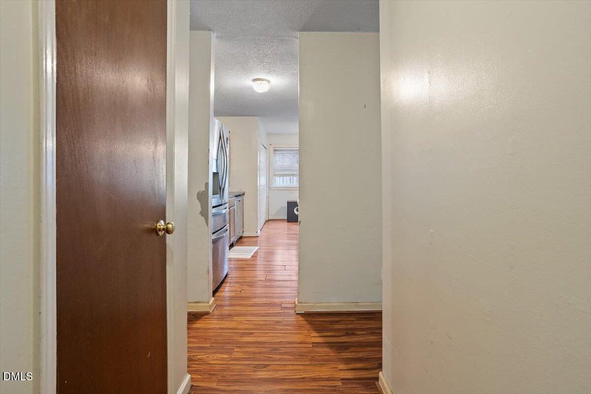 1600 Cranston Road Garner, NC 27529 - Photo 21 of 25 a view of a hallway with wooden floor