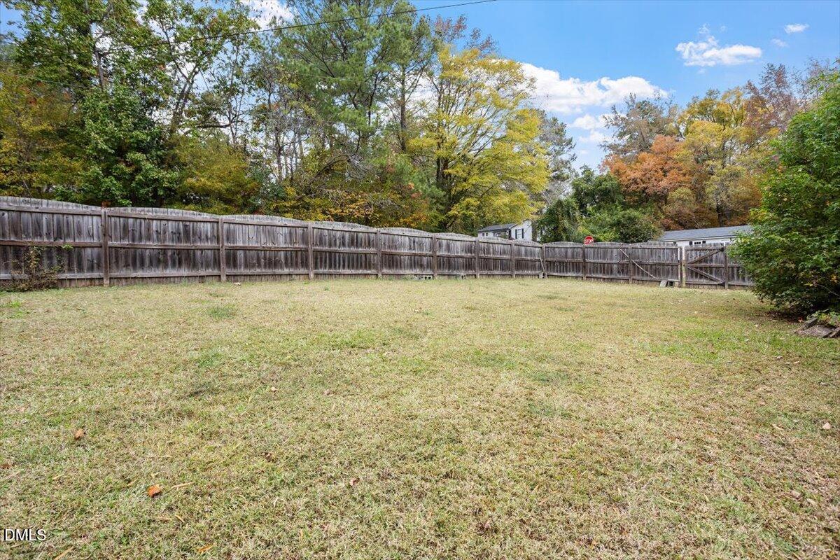 1600 Cranston Road Garner, NC 27529 - Photo 4 of 25 a view of a swimming pool with an outdoor space and seating area