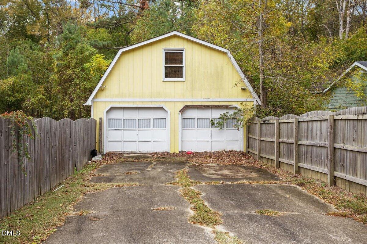 1600 Cranston Road Garner, NC 27529 - Photo 6 of 25 a view of a house with a yard and wooden fence
