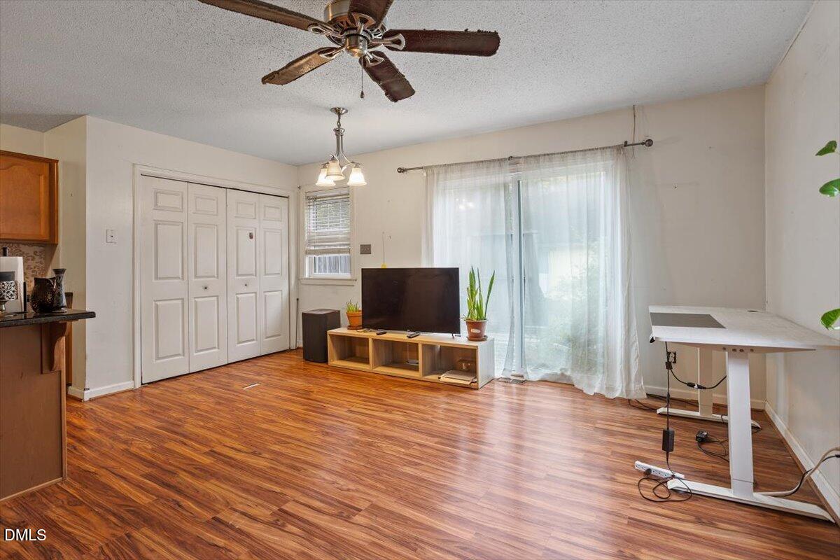 1600 Cranston Road Garner, NC 27529 - Photo 7 of 25 a living room with furniture and a flat screen tv