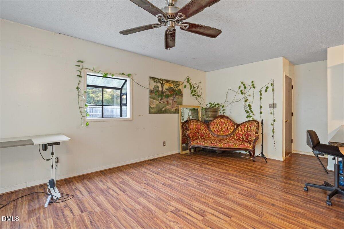 1600 Cranston Road Garner, NC 27529 - Photo 9 of 25 a room with furniture and wooden floor