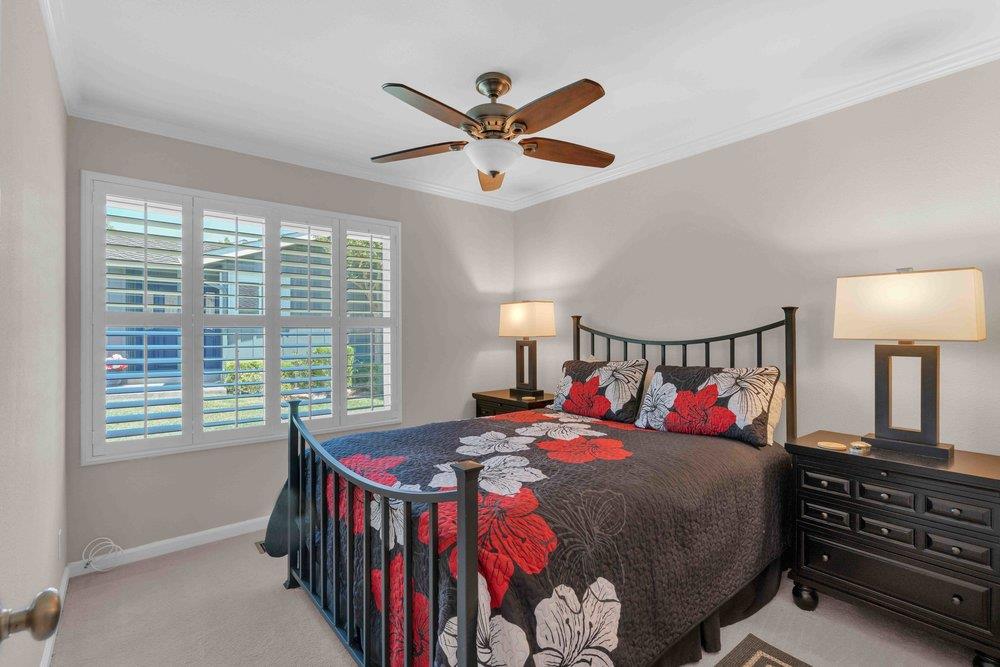 1854 St George Road Danville, CA 94526 - Photo 13 of 47 a bedroom with a bed and a chandelier