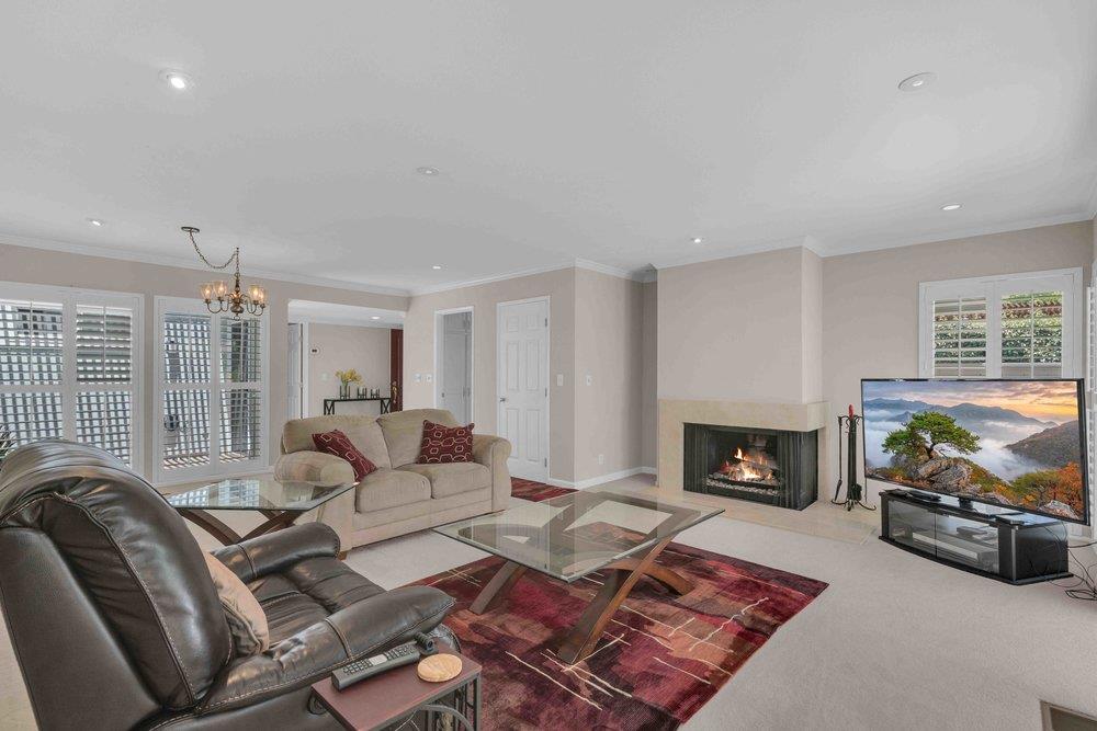 1854 St George Road Danville, CA 94526 - Photo 5 of 47 a living room with furniture a flat screen tv and a fireplace