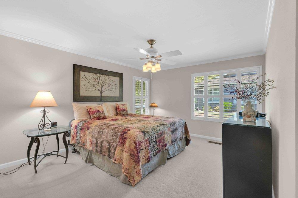 1854 St George Road Danville, CA 94526 - Photo 8 of 47 a bedroom with a bed and a chandelier