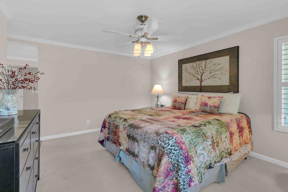 1854 St George Road Danville, CA 94526 - Photo 10 of 47 a bedroom with a bed and a chandelier
