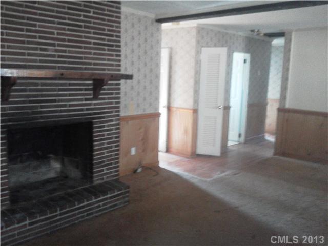 134 Anne Neely Road Gastonia, NC 28056 - Photo 3 of 6 a view of empty room with window and fireplace
