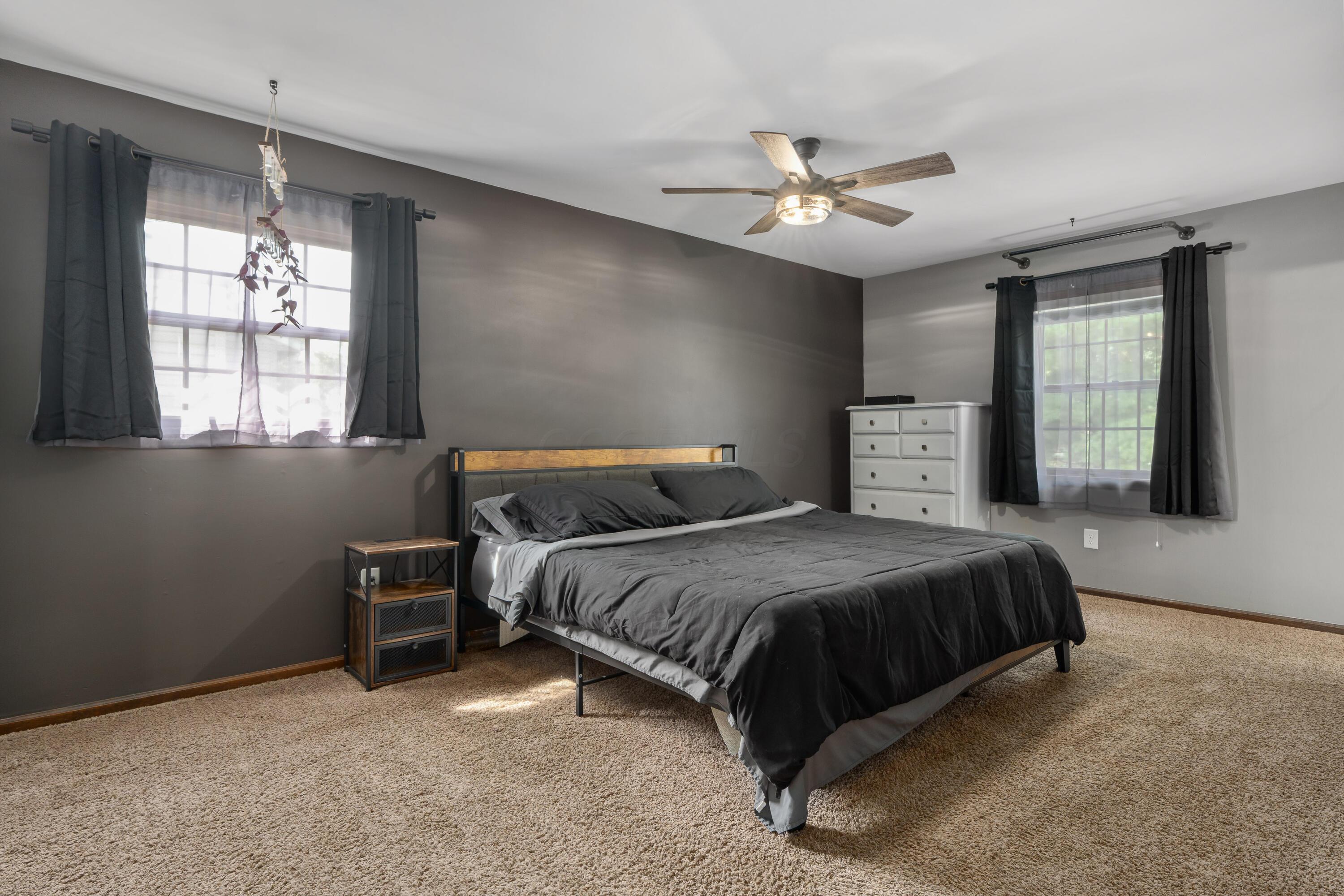 5879 Ravine View Court Columbus, OH 43231 - Photo 15 of 43 Up a few steps is the primary suite! Ceiling fan/light and private bath
