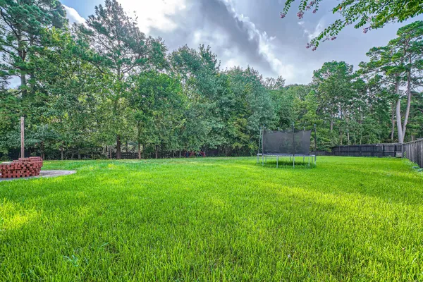 a view of a big yard in front of a house