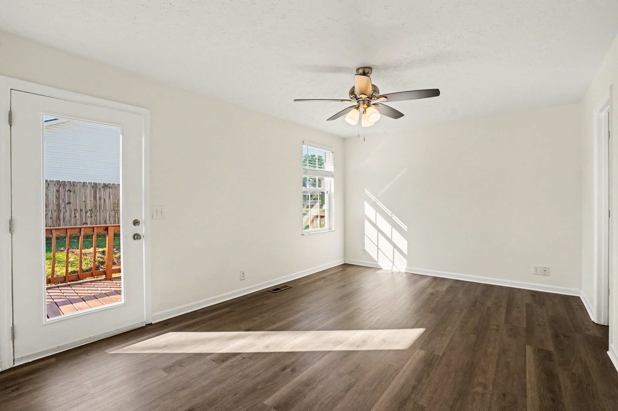 3112 Country Way Road Antioch, TN 37013 - Photo 12 of 19 an empty room with wooden floor chandelier fan and windows