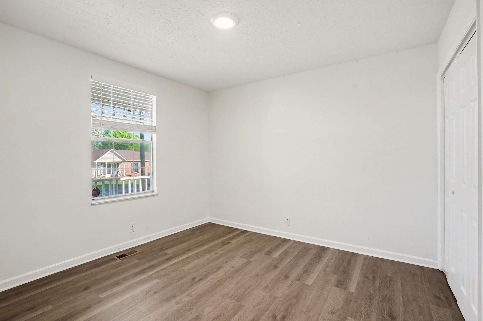 3112 Country Way Road Antioch, TN 37013 - Photo 10 of 19 an empty room with wooden floor and windows