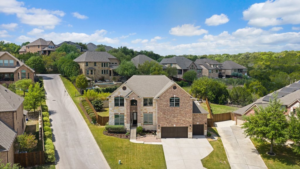 12333 Labrador Bay Court Austin, TX 78732 - Photo 1 of 40 a view of a house with a yard