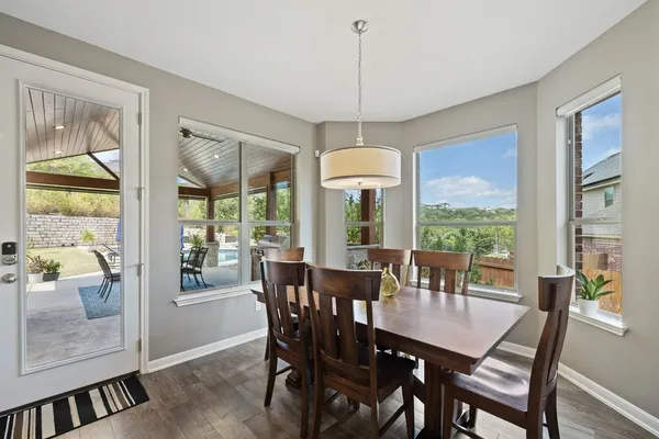 a view of a dining room with furniture window and outside view