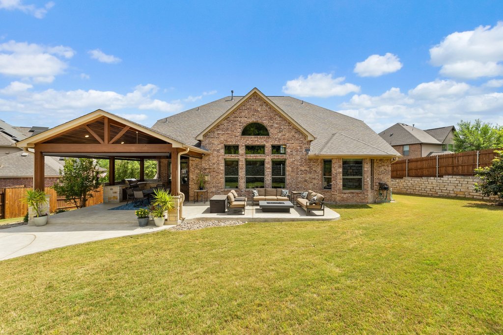 12333 Labrador Bay Court Austin, TX 78732 - Photo 32 of 40 a view of a house with swimming pool and sitting area