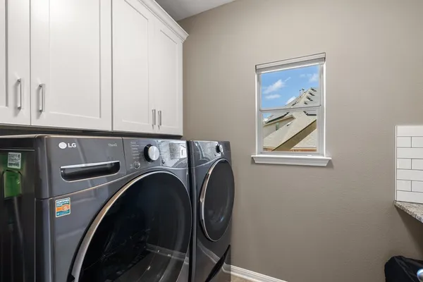 a utility room with dryer and washer