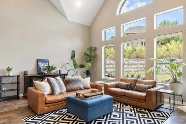 a living room with furniture and a large window