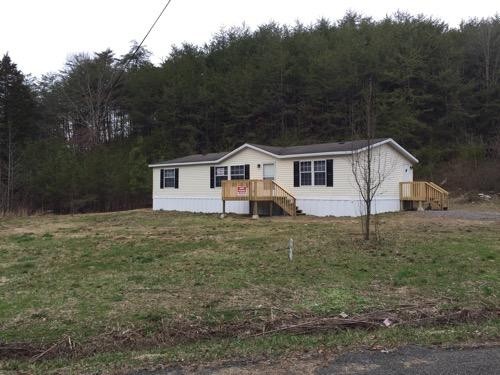 1335 Walnut Grove Church Road Dayton, TN 37321 - Photo 1 of 8 a view of a house with a yard