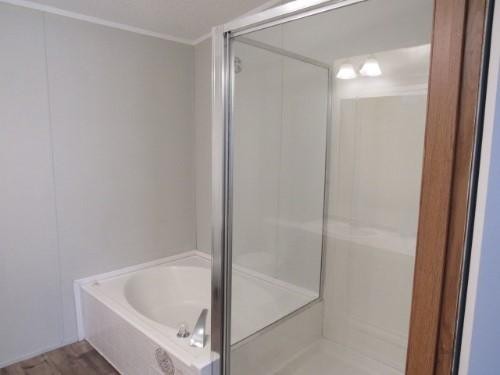 1335 Walnut Grove Church Road Dayton, TN 37321 - Photo 6 of 8 a bathroom with a tub and shower