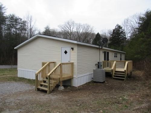 1335 Walnut Grove Church Road Dayton, TN 37321 - Photo 8 of 8 a view of a house with a patio