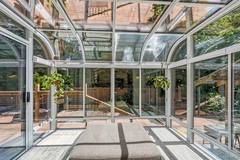 a view of a building with a large window and wooden floor