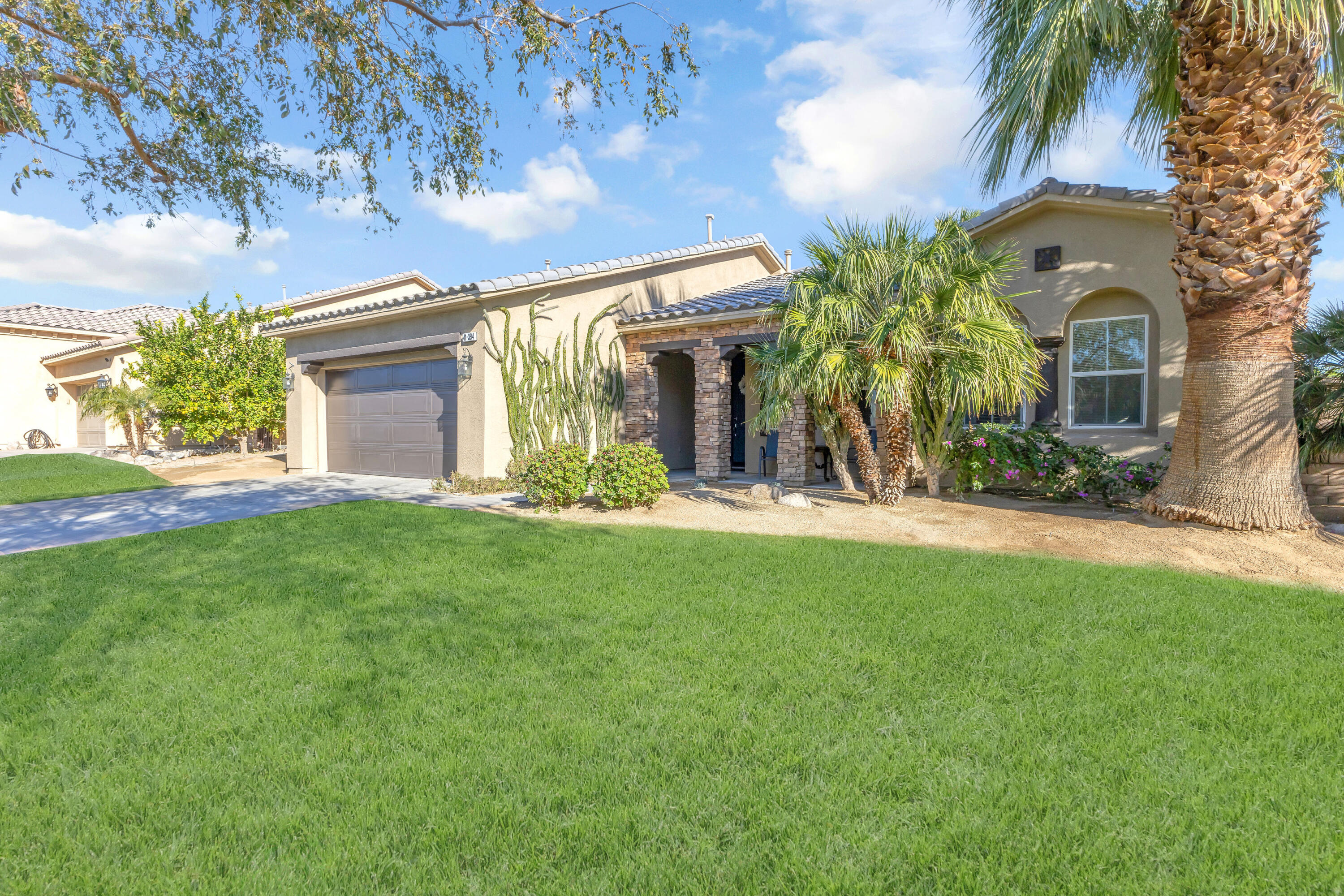 41394 Hanover Street Indio, CA 92203 - Photo 2 of 49 a view of a house with a yard