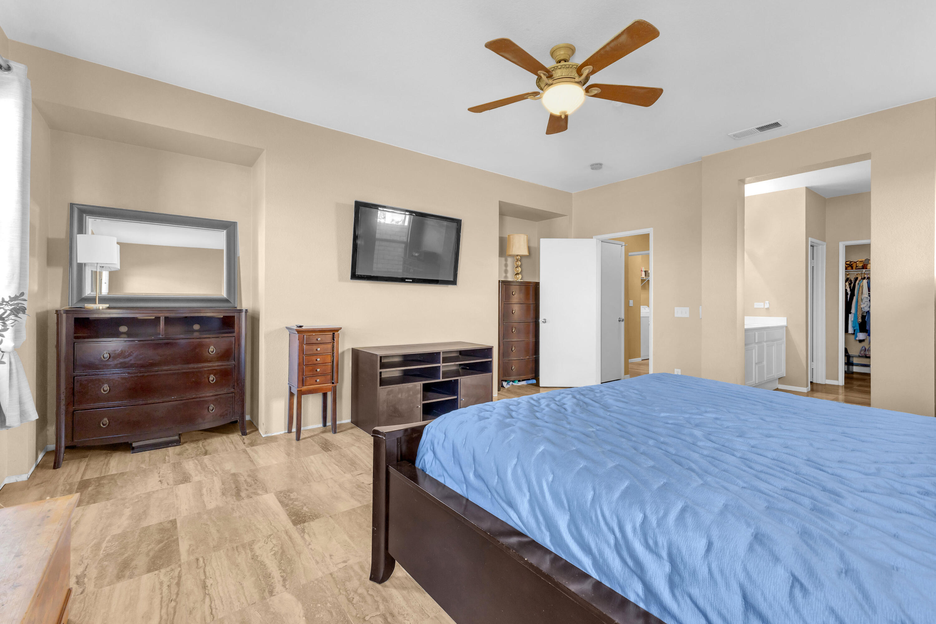 41394 Hanover Street Indio, CA 92203 - Photo 29 of 49 a bedroom with a bed and a flat screen tv