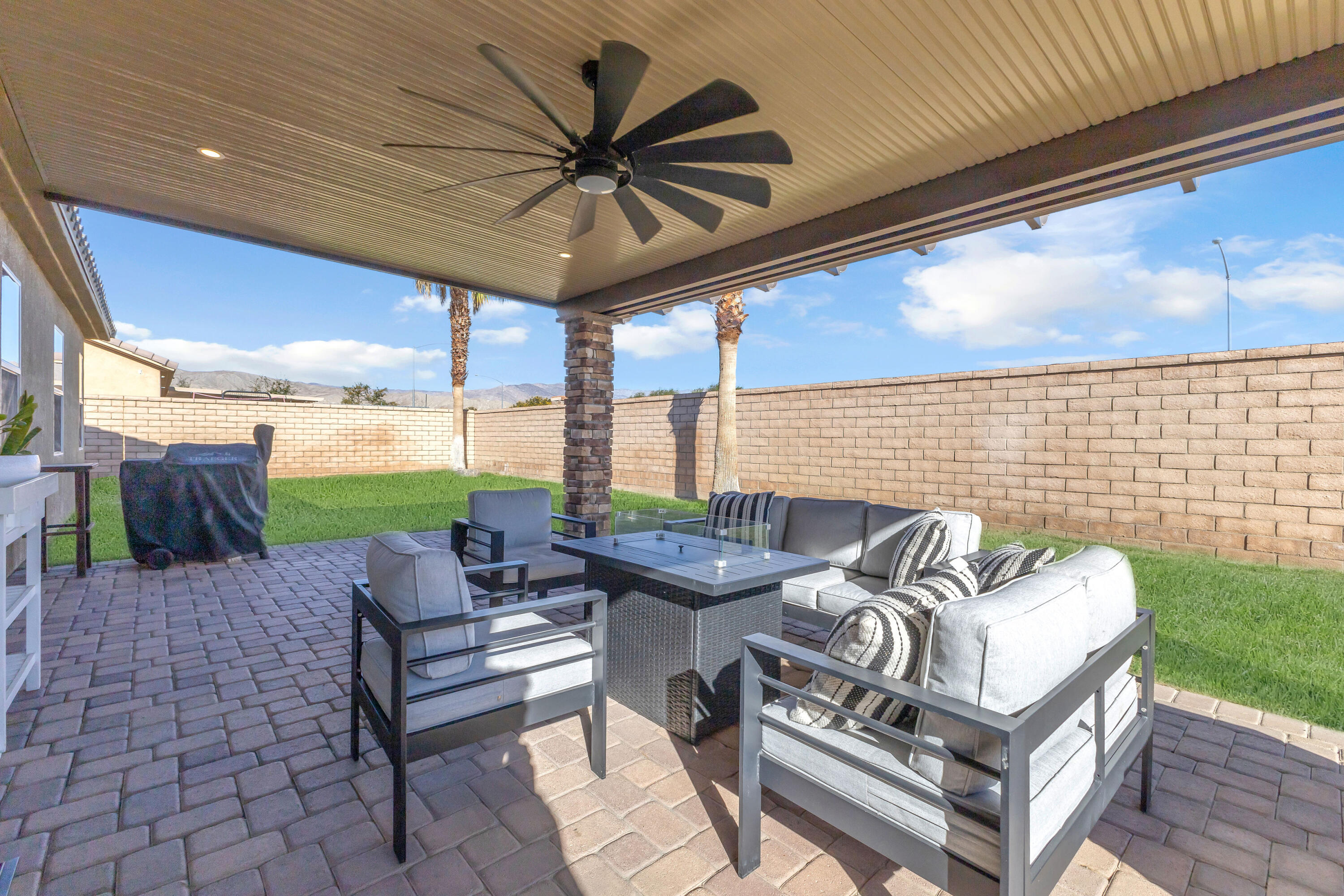 41394 Hanover Street Indio, CA 92203 - Photo 34 of 49 a roof deck with couches and potted plants