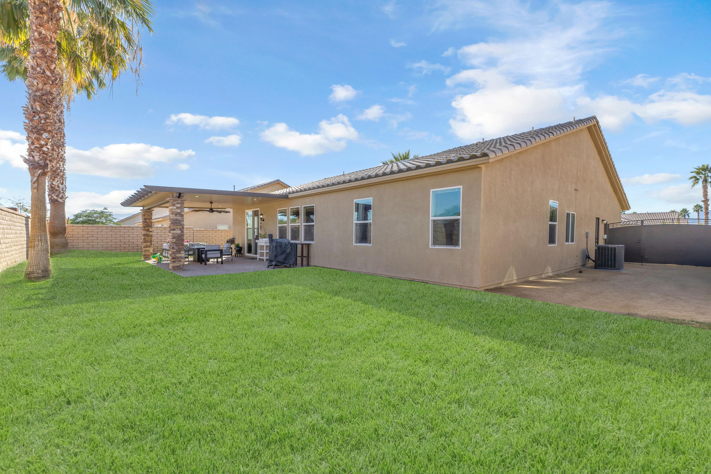 41394 Hanover Street Indio, CA 92203 - Photo 39 of 49 a view of a backyard with plants and a backyard