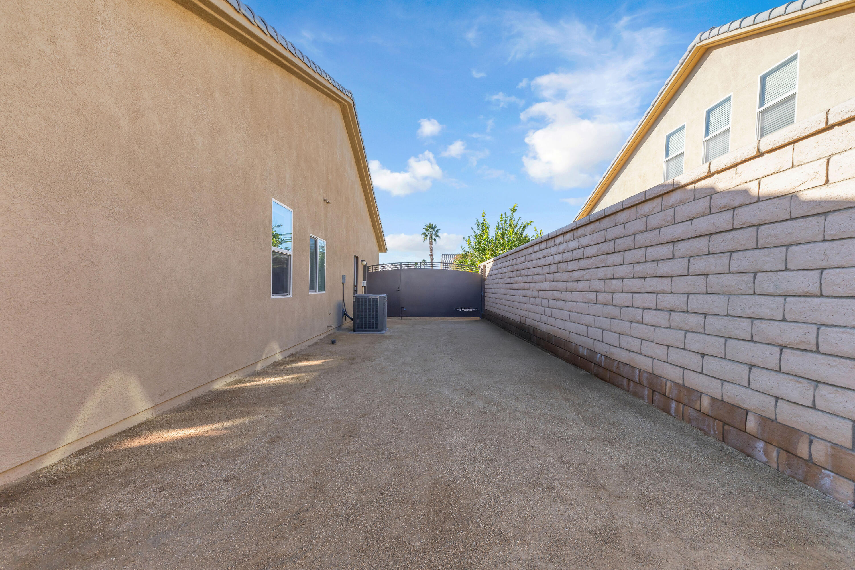 41394 Hanover Street Indio, CA 92203 - Photo 48 of 49 a view of a patio with couches and fire pit