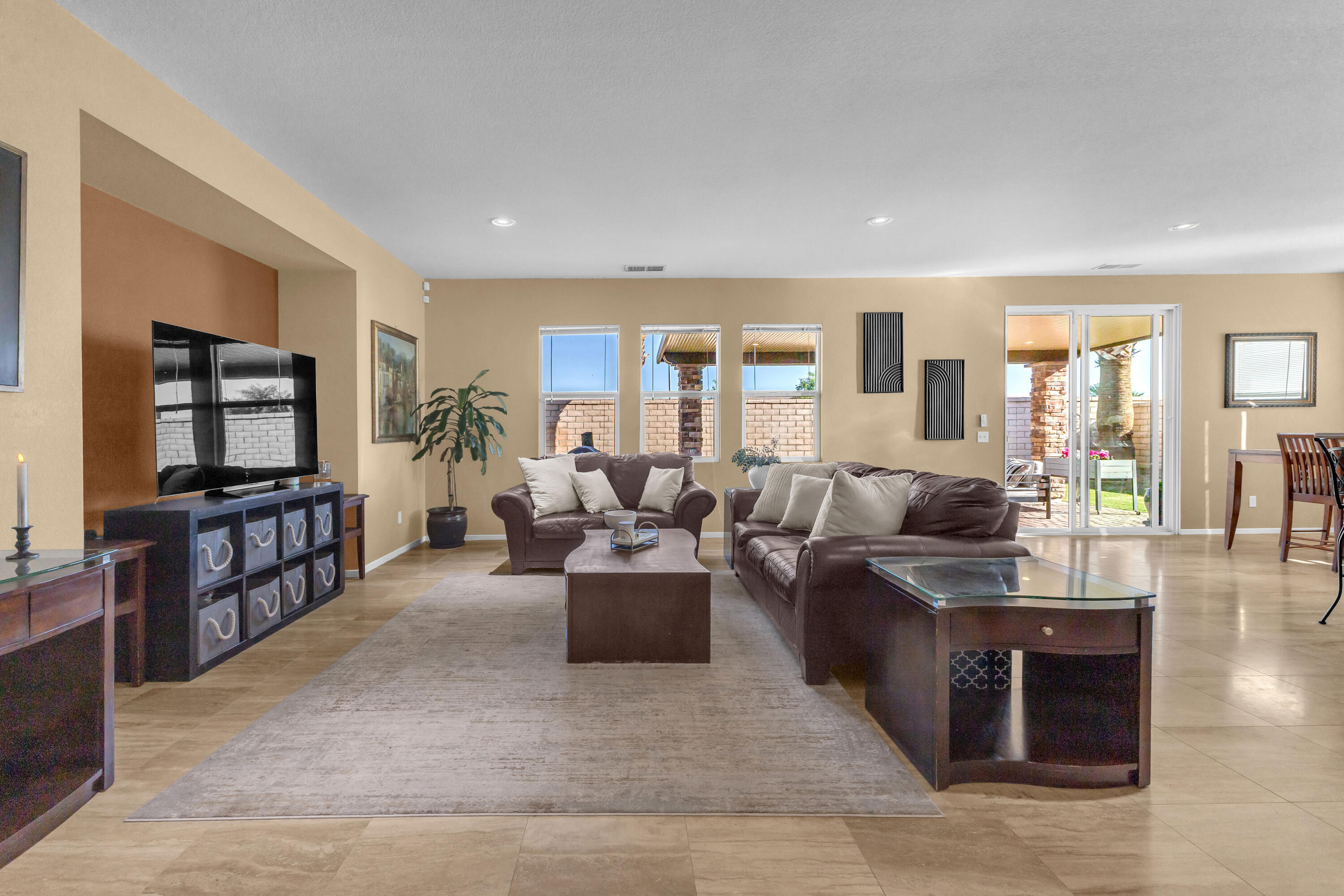 41394 Hanover Street Indio, CA 92203 - Photo 5 of 49 a living room with furniture and a flat screen tv