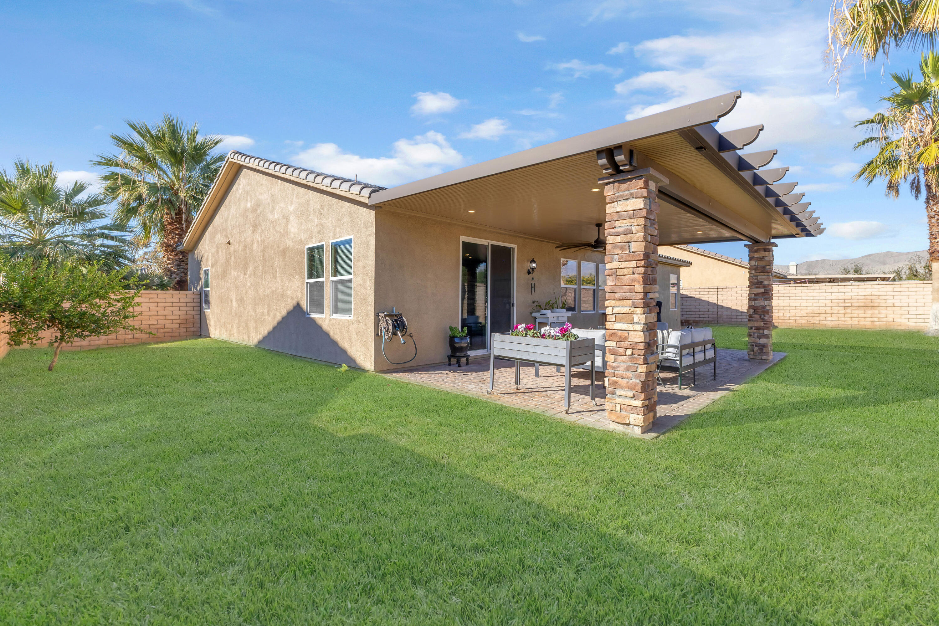 41394 Hanover Street Indio, CA 92203 - Photo 7 of 19 a view of a house with backyard and sitting area