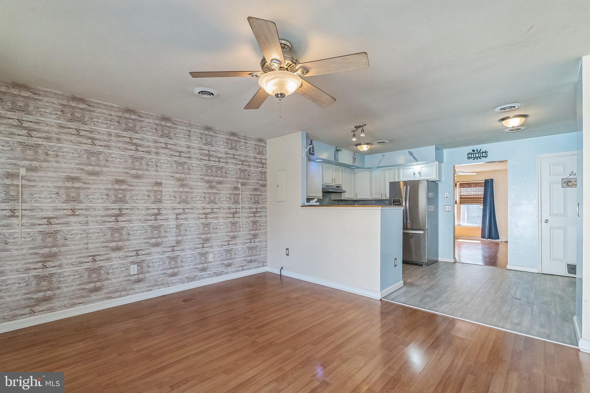 3566 Edgemont Street Philadelphia, PA 19134 - Photo 14 of 25 a view of empty room with wooden floor and ceiling fan