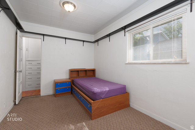 146 West 200 N Street Springville, UT 84663 - Photo 9 of 29 Carpeted room featuring a ceiling-mounted light fixture, a window with horizontal blinds, and white baseboards