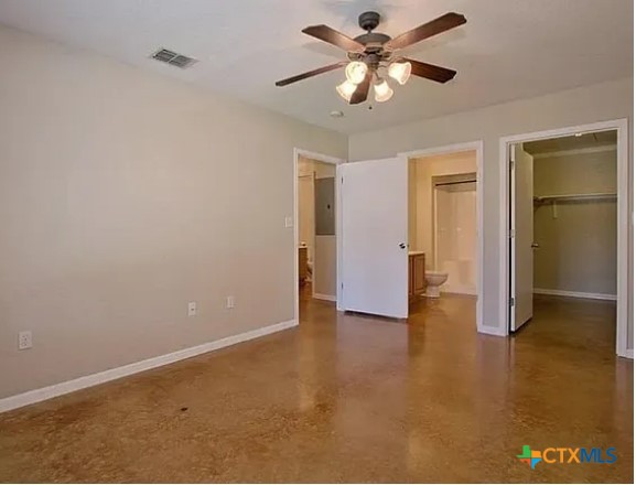 1821 Post Road New Braunfels, TX 78130 - Photo 2 of 6 an empty room with closet and a ceiling fan