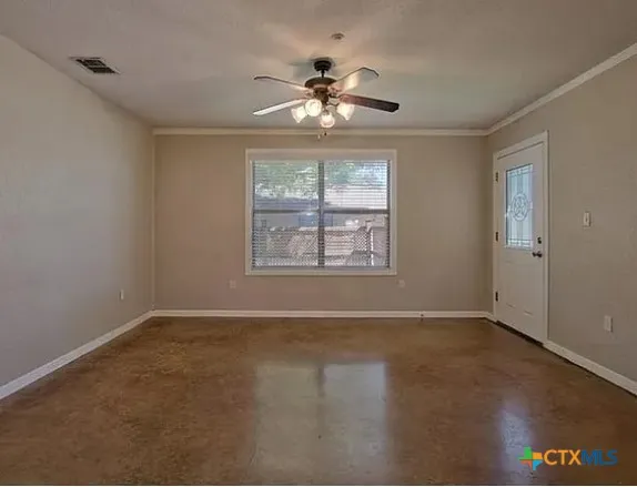a view of an empty room with a window