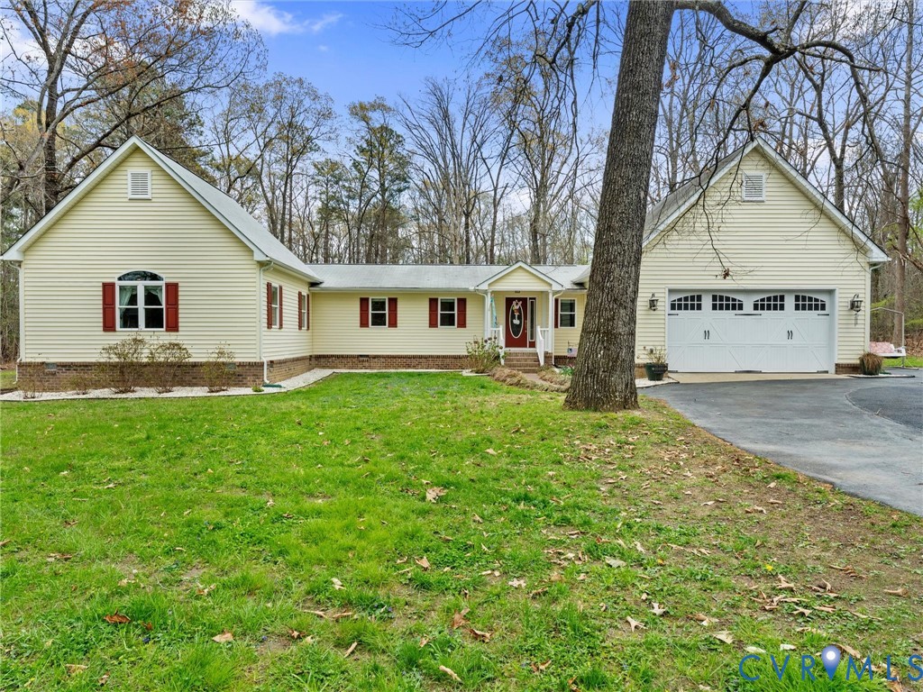 10488 Old Telegraph Road Ashland, VA 23005 - Photo 1 of 69 a view of a yard in front of a house with large trees