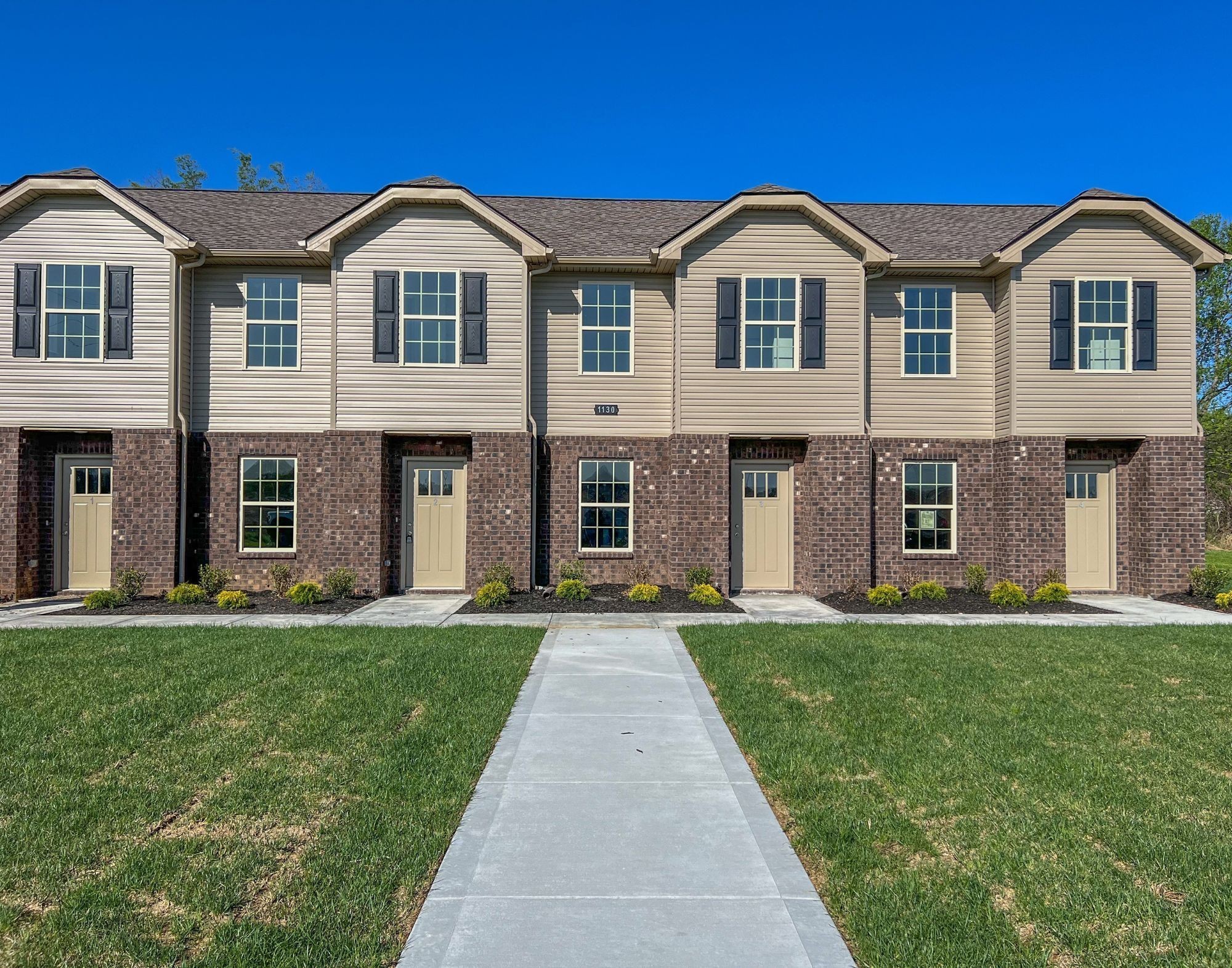 1130 Pembroke Oak Grove Road, Unit 4 Oak Grove, KY 42262 - Photo 1 of 37 front view of a brick house with a yard